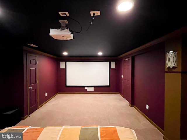 cinema room featuring recessed lighting, baseboards, crown molding, and carpet flooring