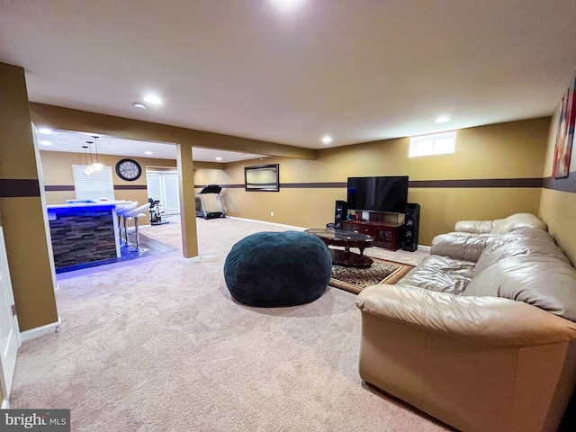 carpeted living room featuring baseboards and recessed lighting