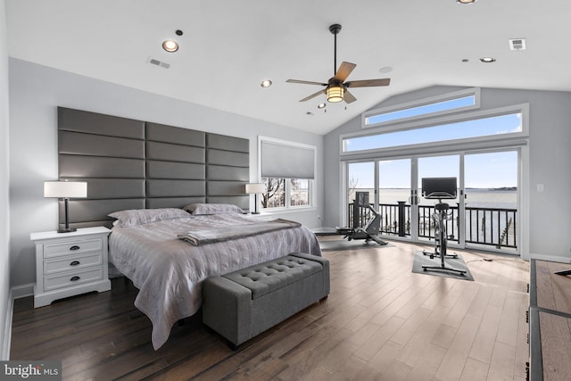 bedroom with wood finished floors, visible vents, and access to exterior