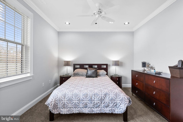 bedroom with ornamental molding, dark carpet, and baseboards