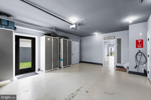 garage featuring baseboards and a garage door opener