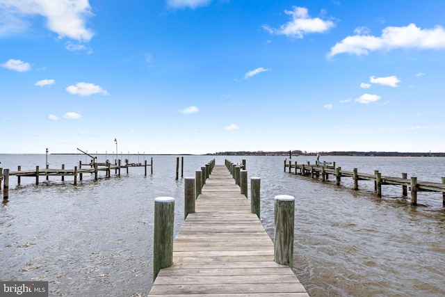 view of dock featuring a water view and boat lift