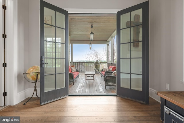 entryway featuring wood-type flooring and french doors