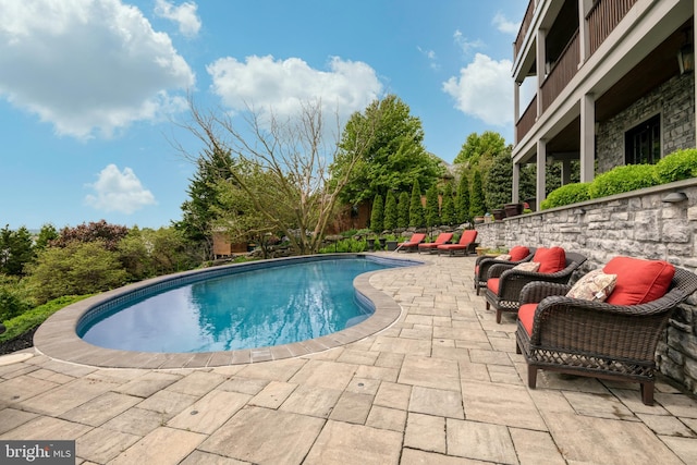 pool featuring a patio area