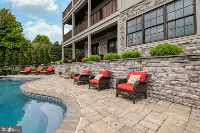 exterior space with an outdoor pool