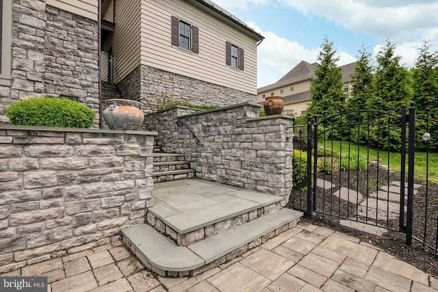 view of gate with fence