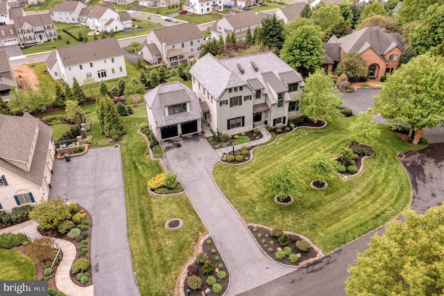 birds eye view of property with a residential view