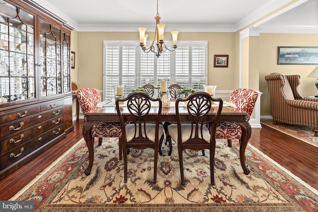 dining space featuring an inviting chandelier, baseboards, dark wood-style floors, and ornamental molding