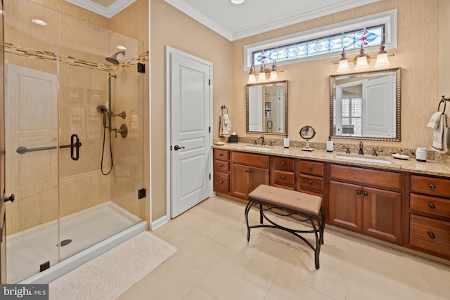 full bathroom featuring double vanity, ornamental molding, a sink, and a shower stall