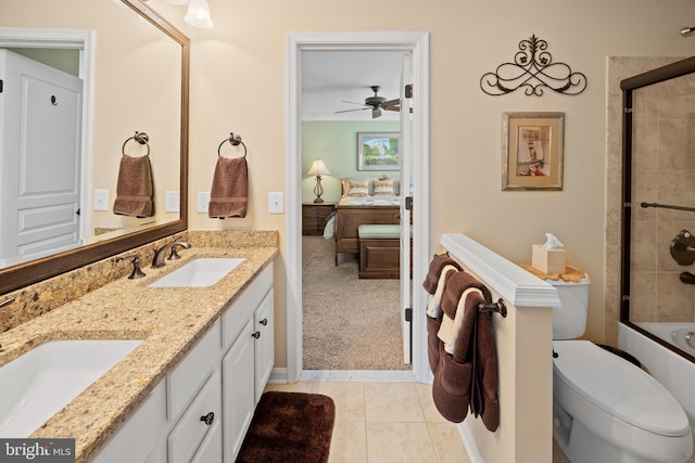 bathroom with double vanity, tile patterned flooring, a sink, and ensuite bathroom