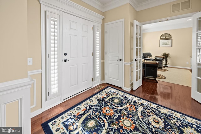 entryway featuring french doors, visible vents, ornamental molding, wood finished floors, and baseboards