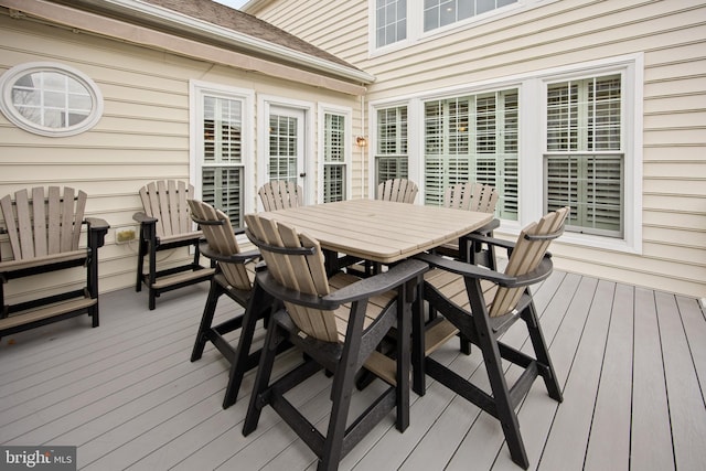 deck featuring outdoor dining area