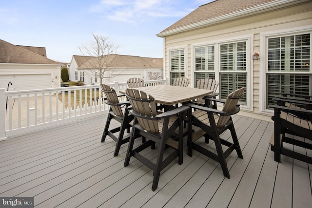 wooden terrace with outdoor dining space