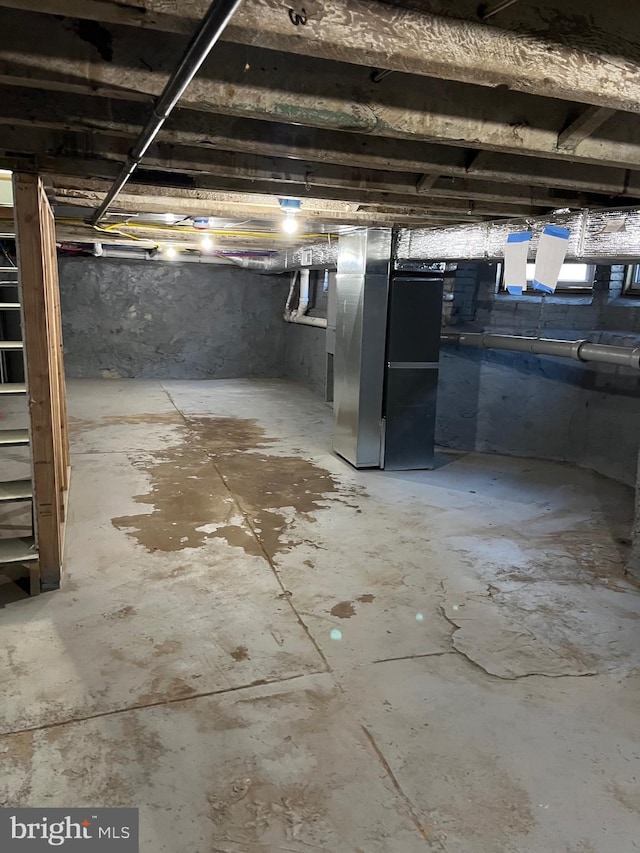 unfinished basement with heating unit