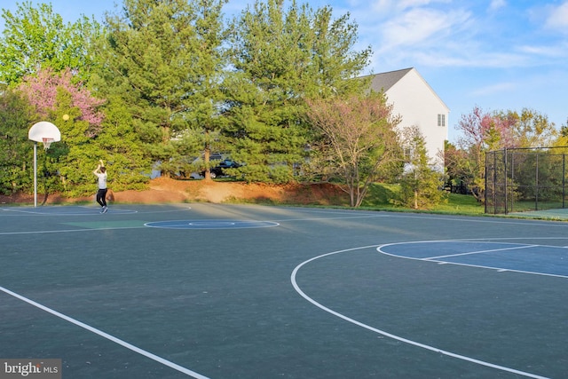 view of sport court featuring community basketball court and fence