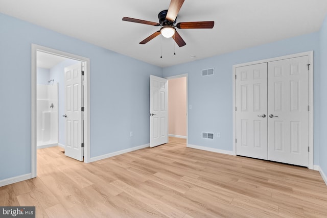 unfurnished bedroom with light wood-type flooring, visible vents, and baseboards