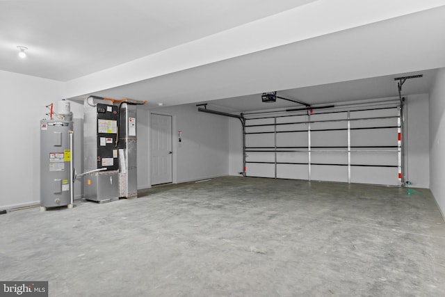 garage with water heater, a garage door opener, and heating unit