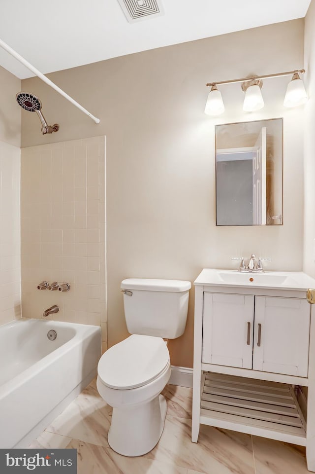 bathroom with shower / tub combination, toilet, vanity, visible vents, and baseboards