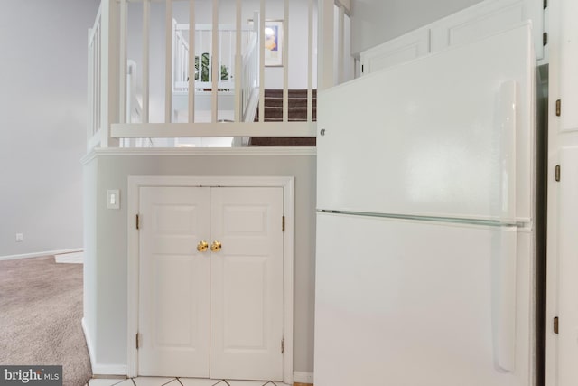 7014 Ellingham Cir Unit F, Alexandria, VA 22315 - detailed view of freestanding refrigerator, carpet floors, and baseboards