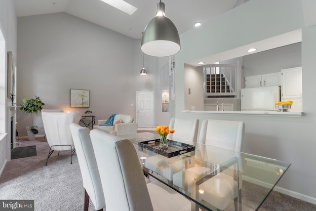 7014 Ellingham Cir Unit F, Alexandria, VA 22315 - dining room with high vaulted ceiling, stairs, carpet flooring, a skylight, and recessed lighting