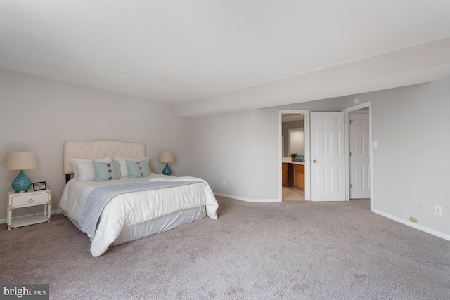 7014 Ellingham Cir Unit F, Alexandria, VA 22315 - bedroom featuring light colored carpet, baseboards, and connected bathroom