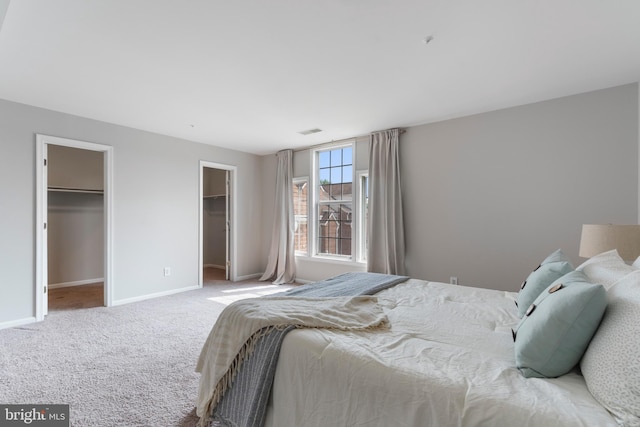 7014 Ellingham Cir Unit F, Alexandria, VA 22315 - carpeted bedroom featuring baseboards and multiple closets