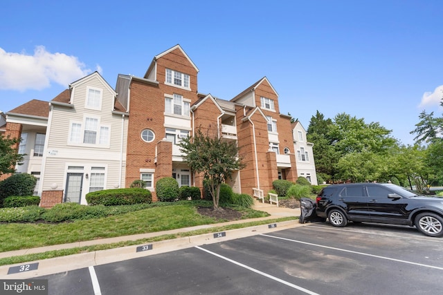 7014 Ellingham Cir Unit F, Alexandria, VA 22315 - view of building exterior featuring uncovered parking
