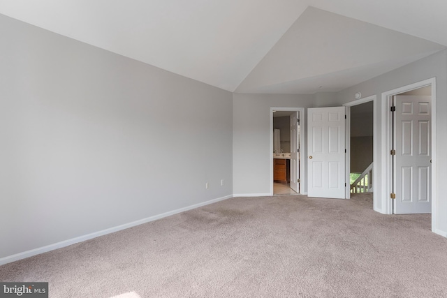 7014 Ellingham Cir Unit F, Alexandria, VA 22315 - unfurnished bedroom with carpet, baseboards, vaulted ceiling, and ensuite bath