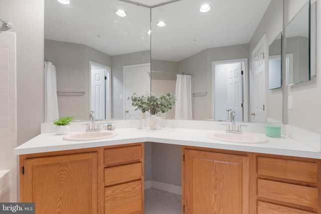 7014 Ellingham Cir Unit F, Alexandria, VA 22315 - bathroom with double vanity, a shower with shower curtain, recessed lighting, and a tub