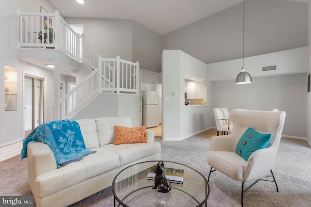 7014 Ellingham Cir Unit F, Alexandria, VA 22315 - living area featuring high vaulted ceiling, carpet, baseboards, and stairway