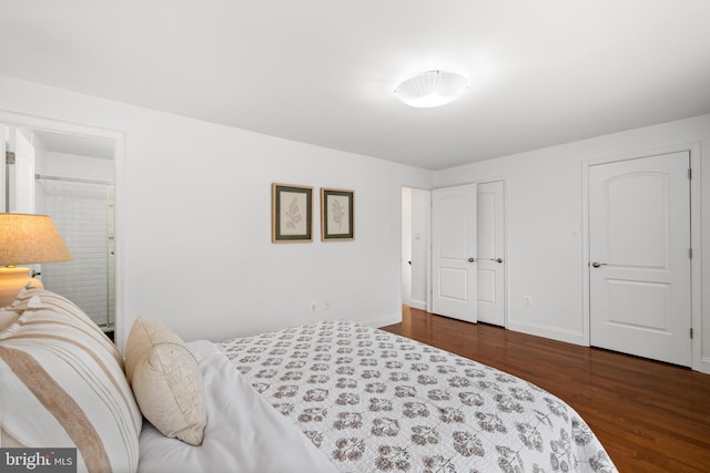 bedroom featuring wood finished floors and baseboards