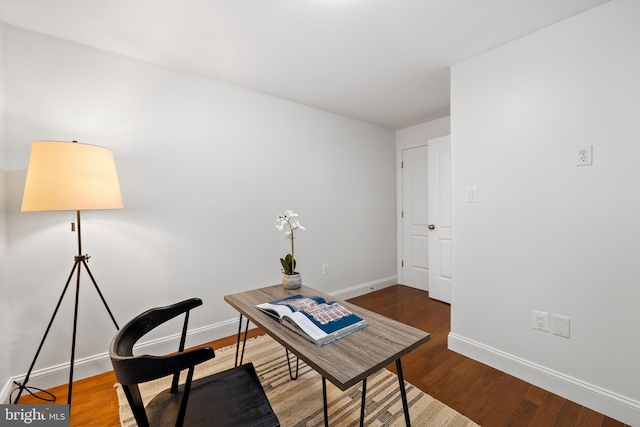 office space featuring wood finished floors and baseboards