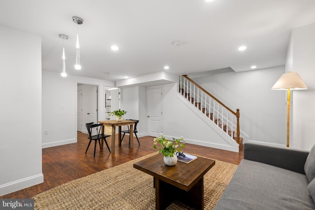 living room with stairway, recessed lighting, wood finished floors, and baseboards