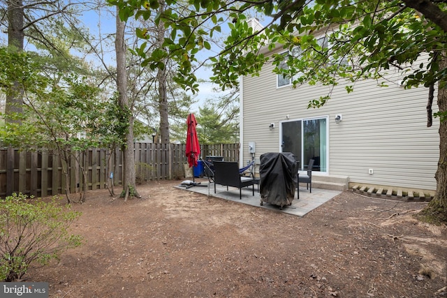 exterior space featuring a grill and a fenced backyard