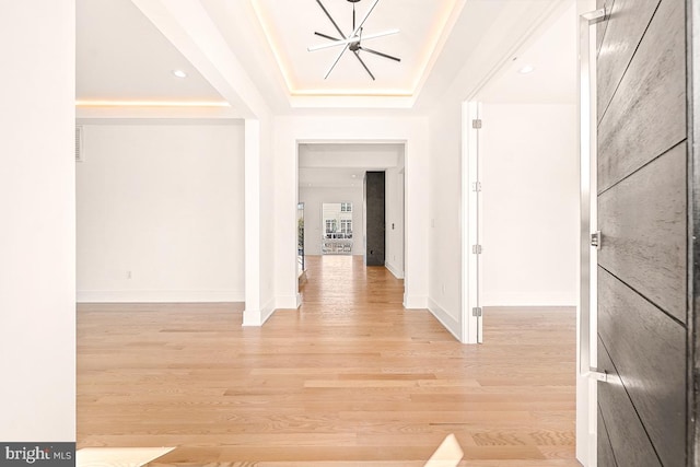 entryway featuring light wood-style flooring and baseboards