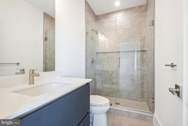 full bathroom featuring a stall shower, tile patterned flooring, vanity, and toilet