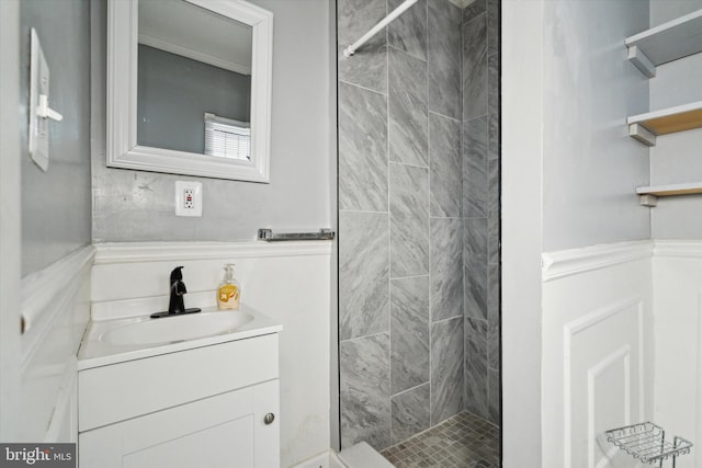 full bath with a stall shower and vanity