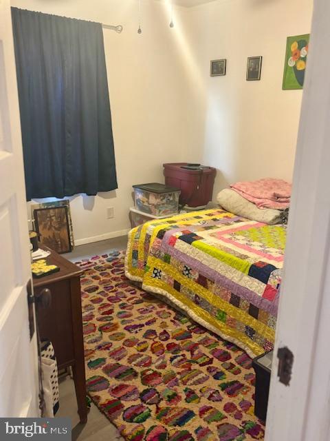 bedroom featuring baseboards