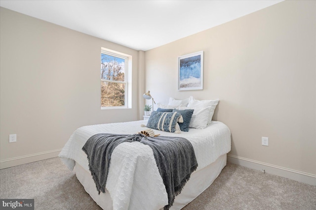 bedroom with carpet flooring and baseboards