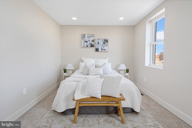 carpeted bedroom featuring recessed lighting and baseboards