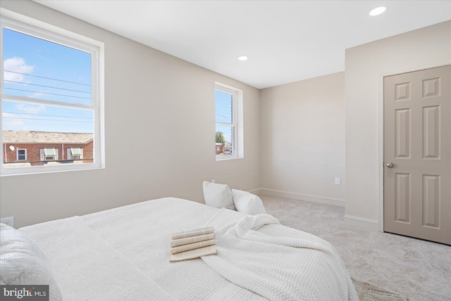 carpeted bedroom with recessed lighting and baseboards