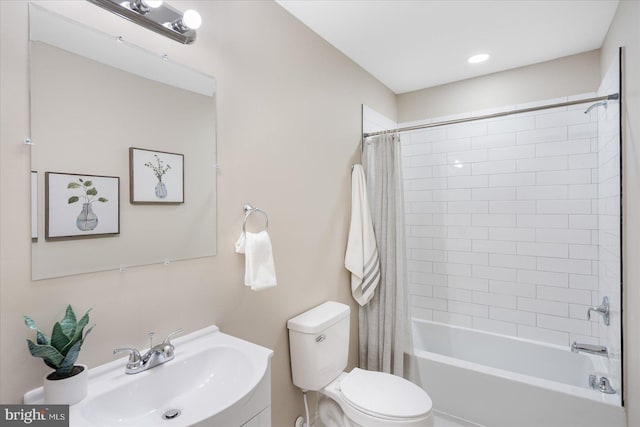 bathroom with vanity, toilet, and shower / bath combo with shower curtain