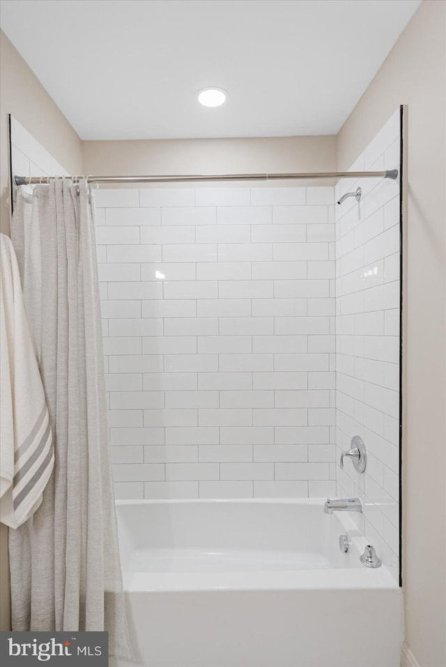 bathroom with shower / bath combination with curtain