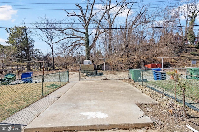 view of patio with a gate and fence