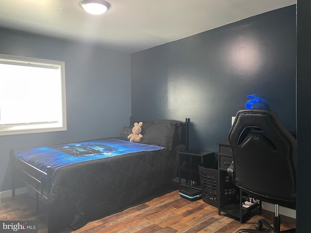 bedroom featuring wood finished floors