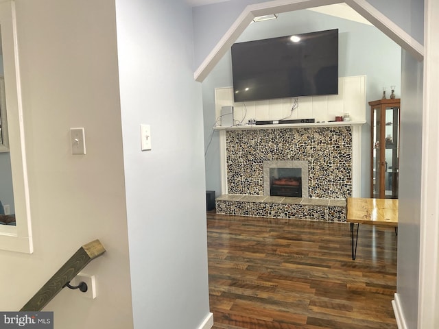 living room featuring wood finished floors and a fireplace