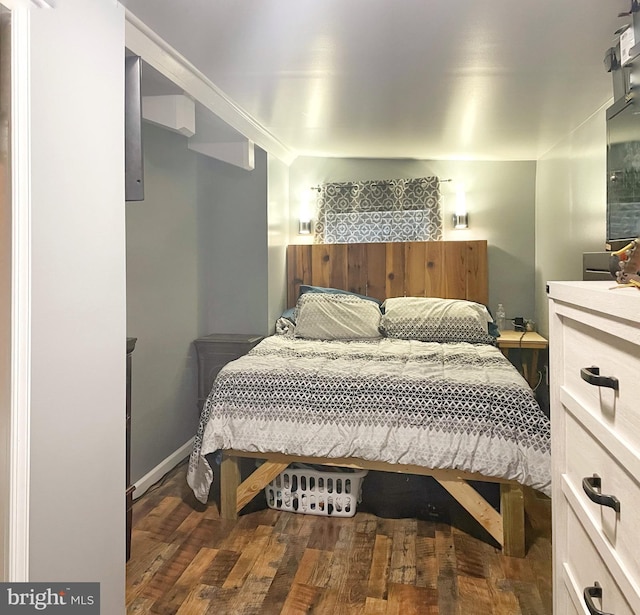 bedroom featuring wood finished floors