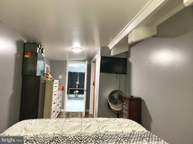 bedroom with dark wood-type flooring