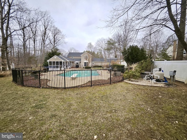 view of pool with a fenced in pool, a patio area, fence, and a lawn