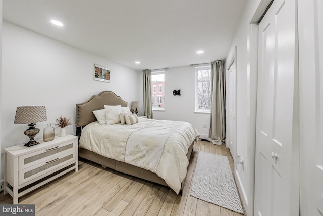 bedroom with light wood-type flooring and recessed lighting